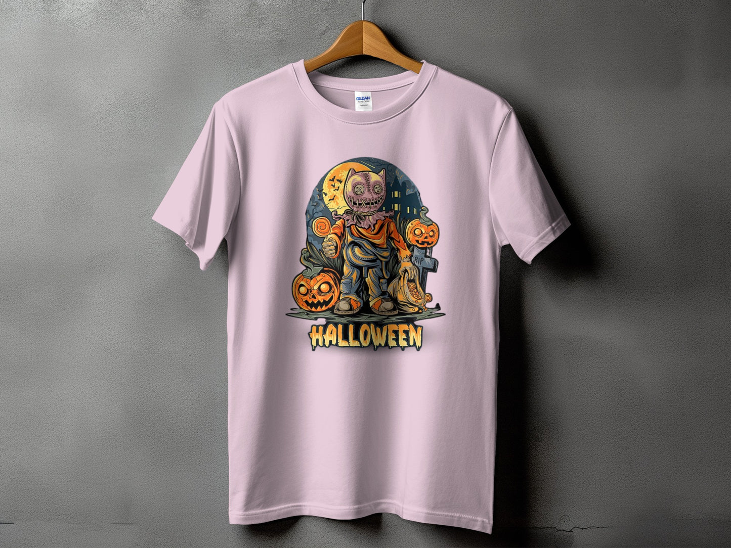 Pink t-shirt with a jack-o'-lantern character and the word "HALLOWEEN."