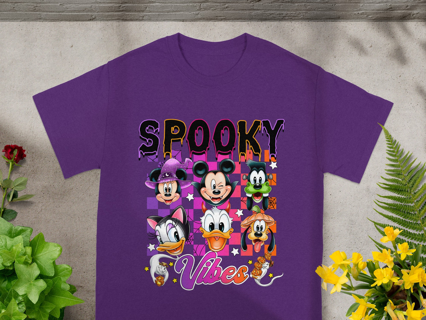 Purple t-shirt with "Spooky Vibes" and Disney characters in Halloween costumes.