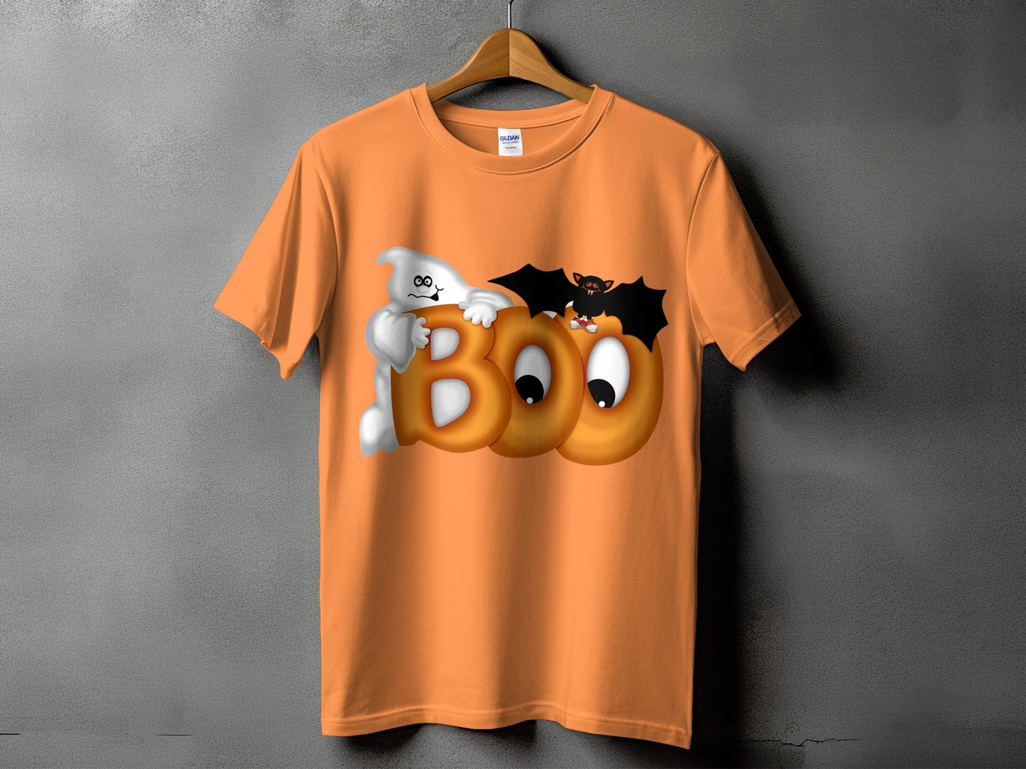 Orange t-shirt with cartoon ghost, bat, and "BOO" text for Halloween.
