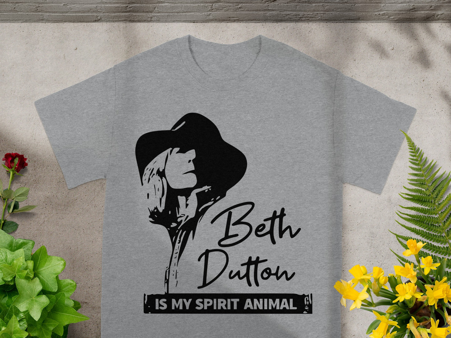 Grey t-shirt with Beth Dutton spirit animal graphic and text.
