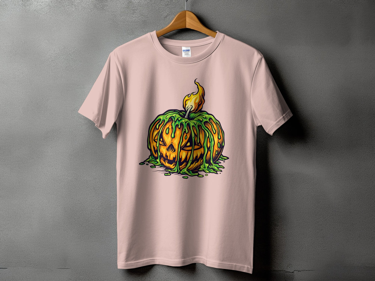 T-shirt with a carved pumpkin covered in green slime and a flame.