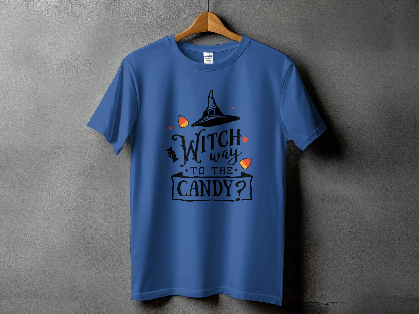 Blue t-shirt with "Witch way to the candy?" Halloween graphic and candy corn.