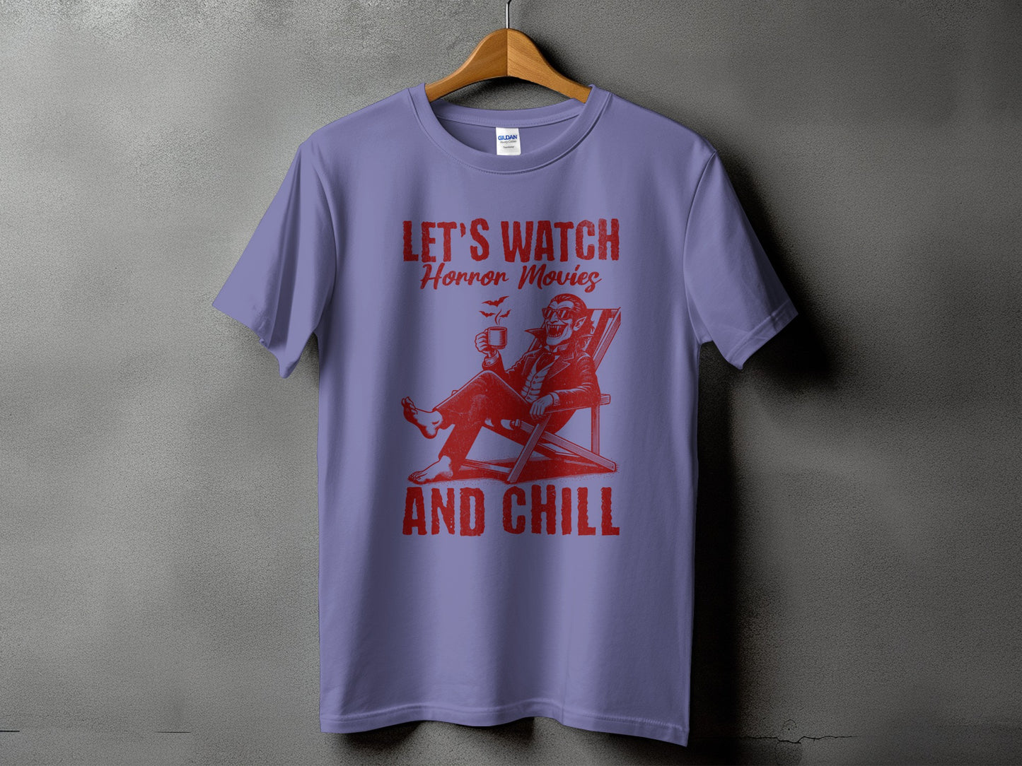 Purple t-shirt with red graphic: "Let's Watch Horror Movies And Chill" and a vampire.
