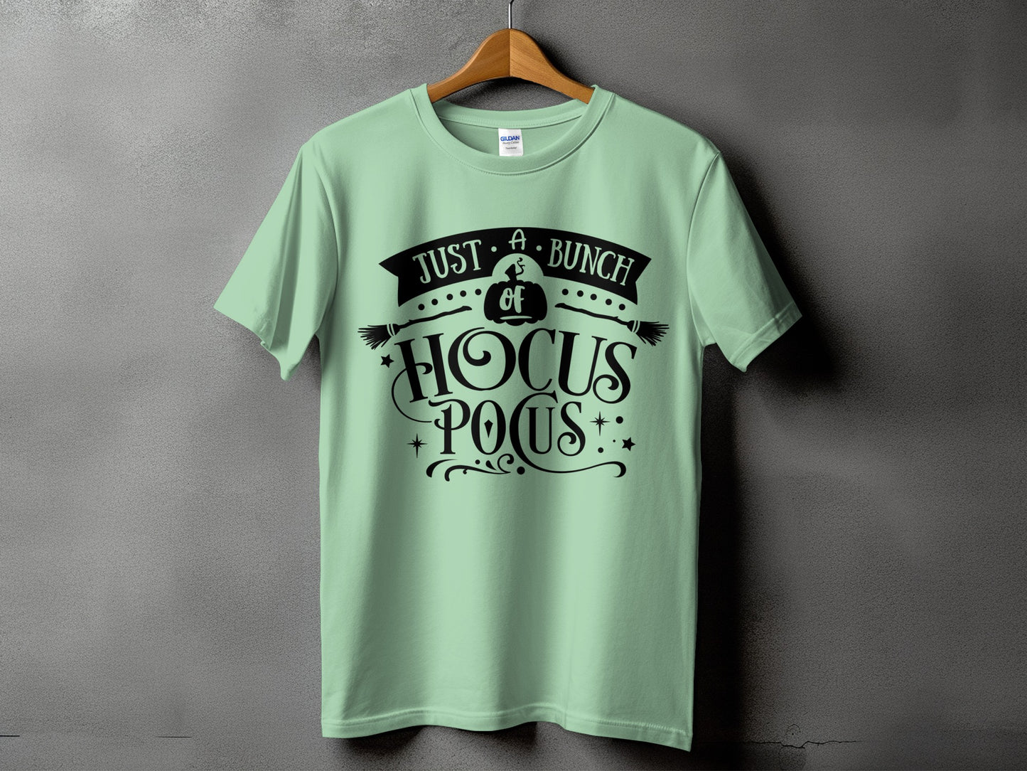 Light green t-shirt with black "Just a bunch of Hocus Pocus" graphic.