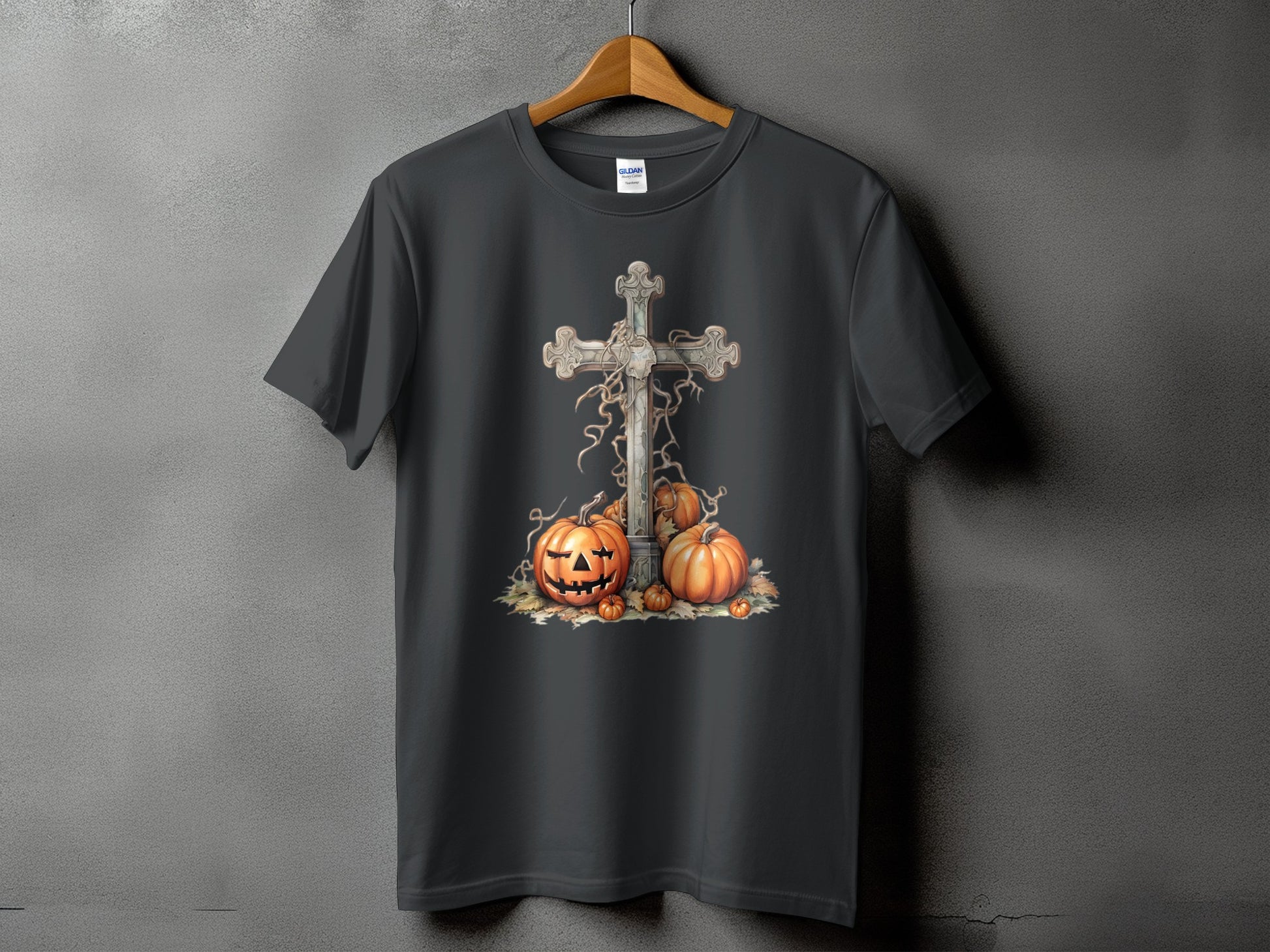 Dark gray t-shirt with a Halloween cross and pumpkins graphic design.