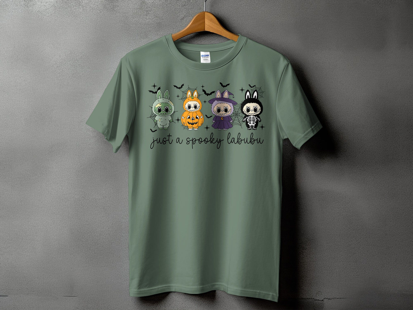 Green t-shirt with four cartoon characters and "just a spooky labubu" text.