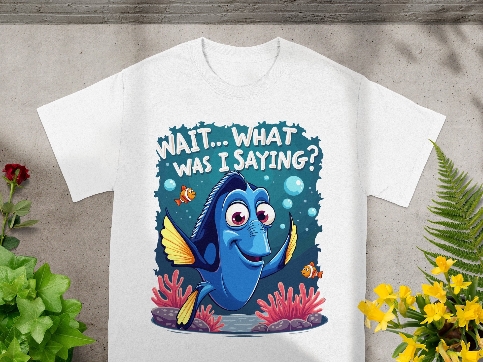 White t-shirt with Dory from Finding Nemo saying "Wait... What was I saying?".