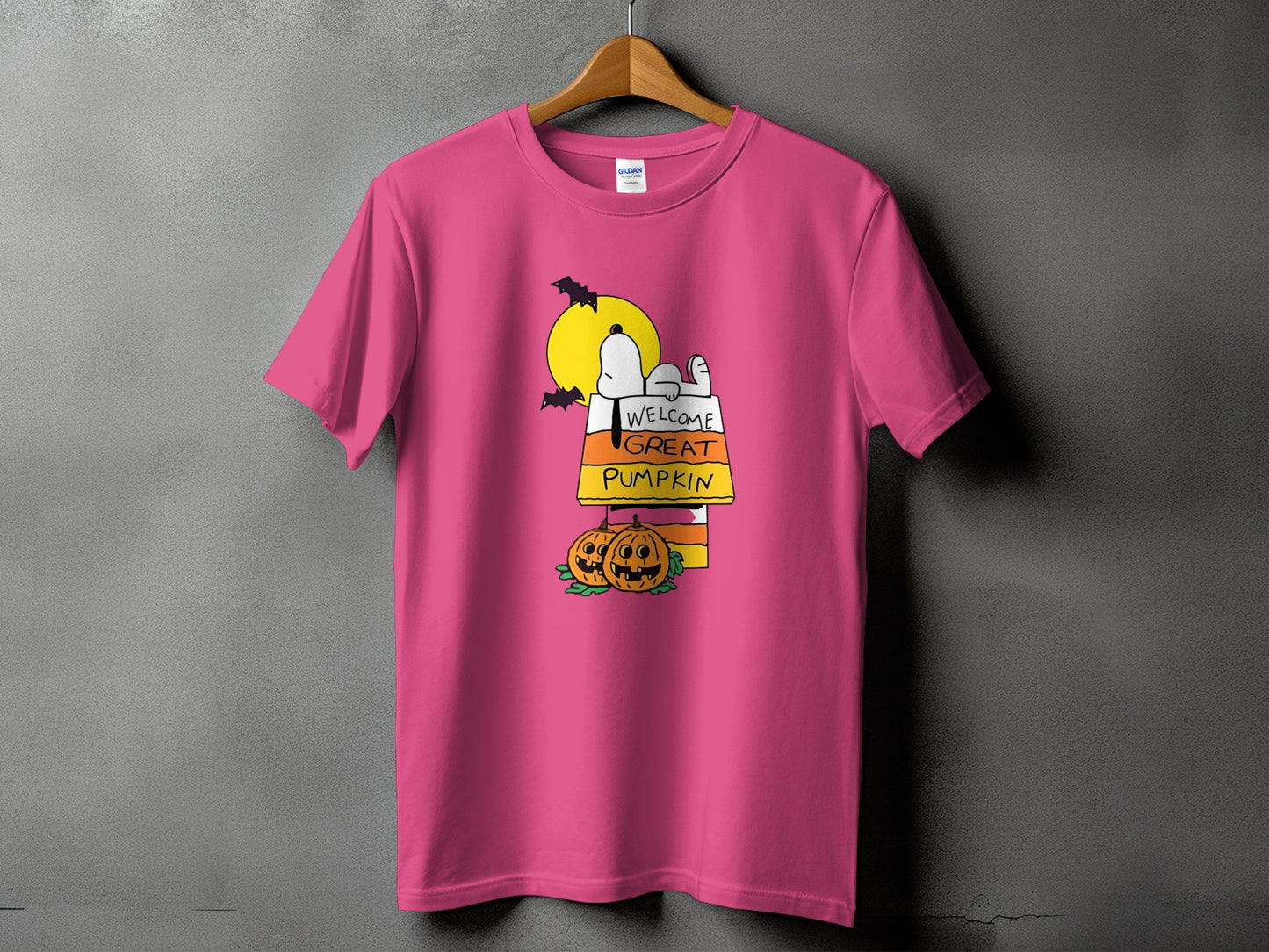 Pink t-shirt with Snoopy and text "Welcome Great Pumpkin".