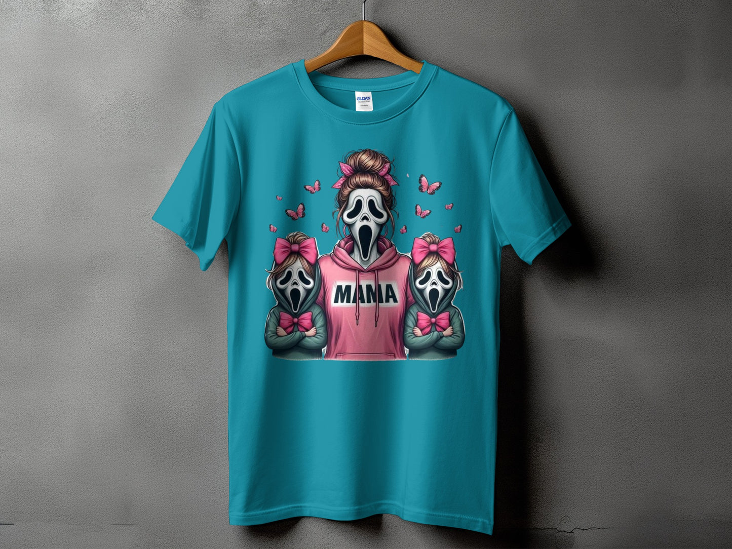 Teal t-shirt with "Mama" text and ghost masks with pink bows and butterflies.