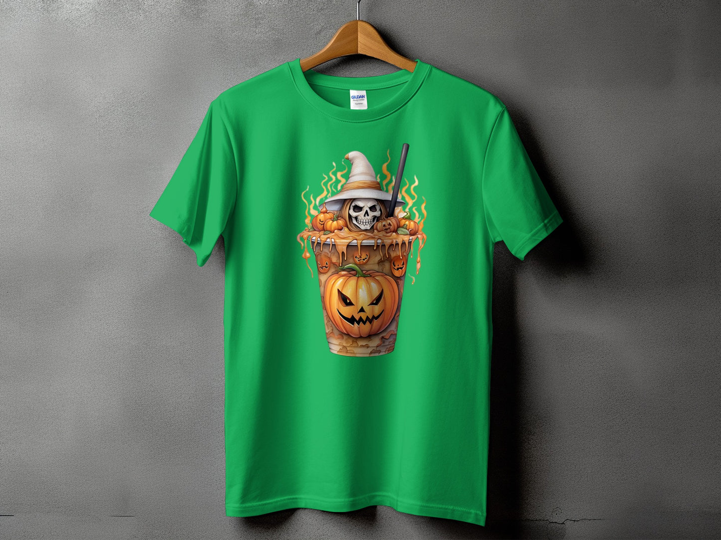 Green t-shirt with a Halloween-themed graphic of a skull wearing a witch hat and pumpkins.