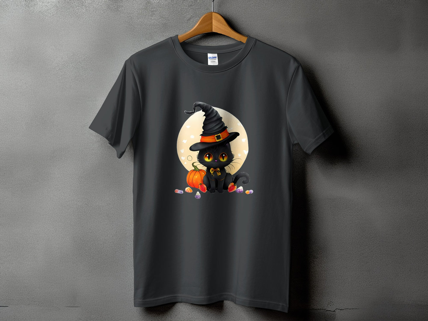 Black cat in witch hat with pumpkin and candy corn on a dark gray t-shirt.