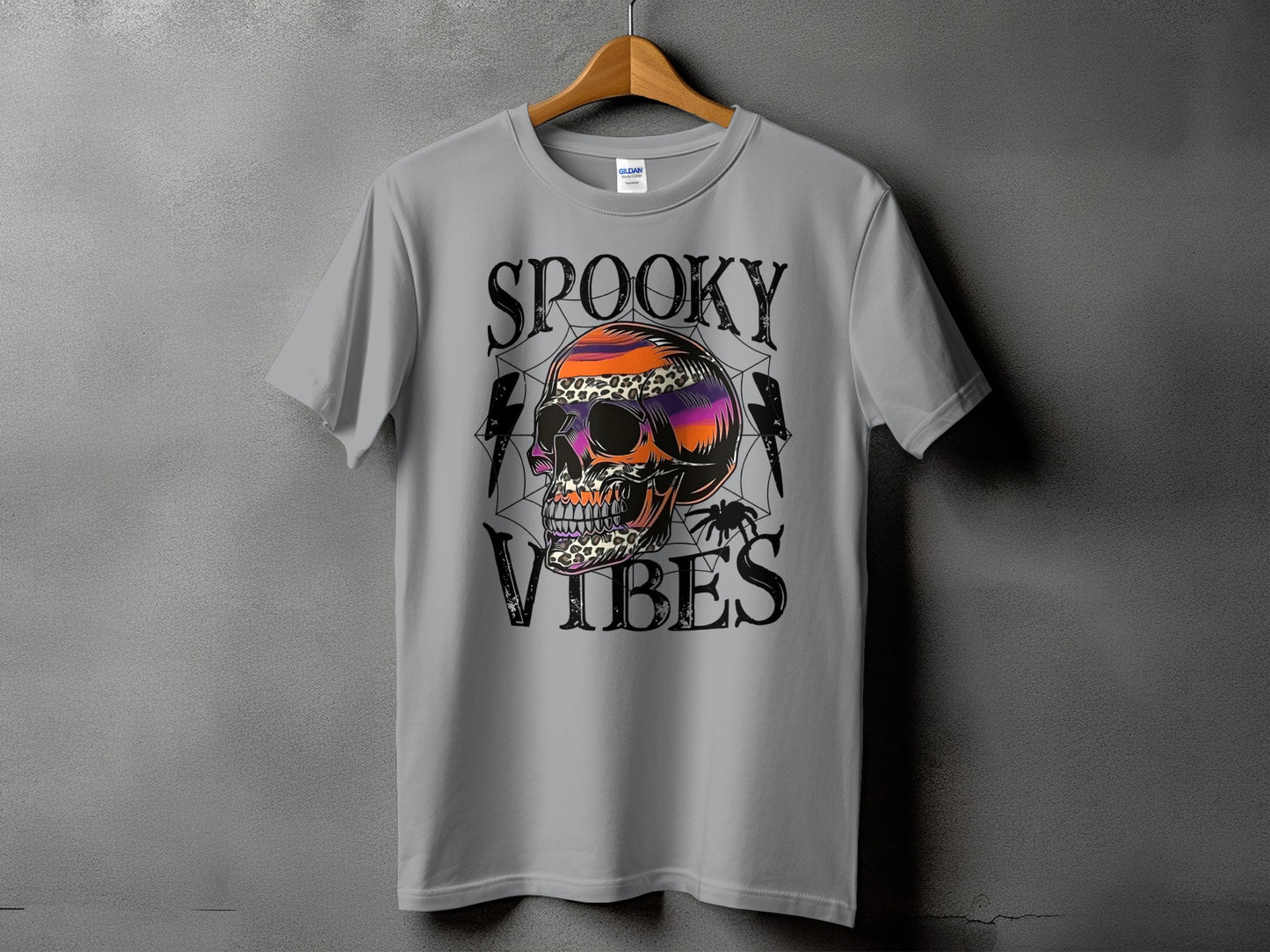 Grey t-shirt with "Spooky Vibes" and a colorful skull graphic.