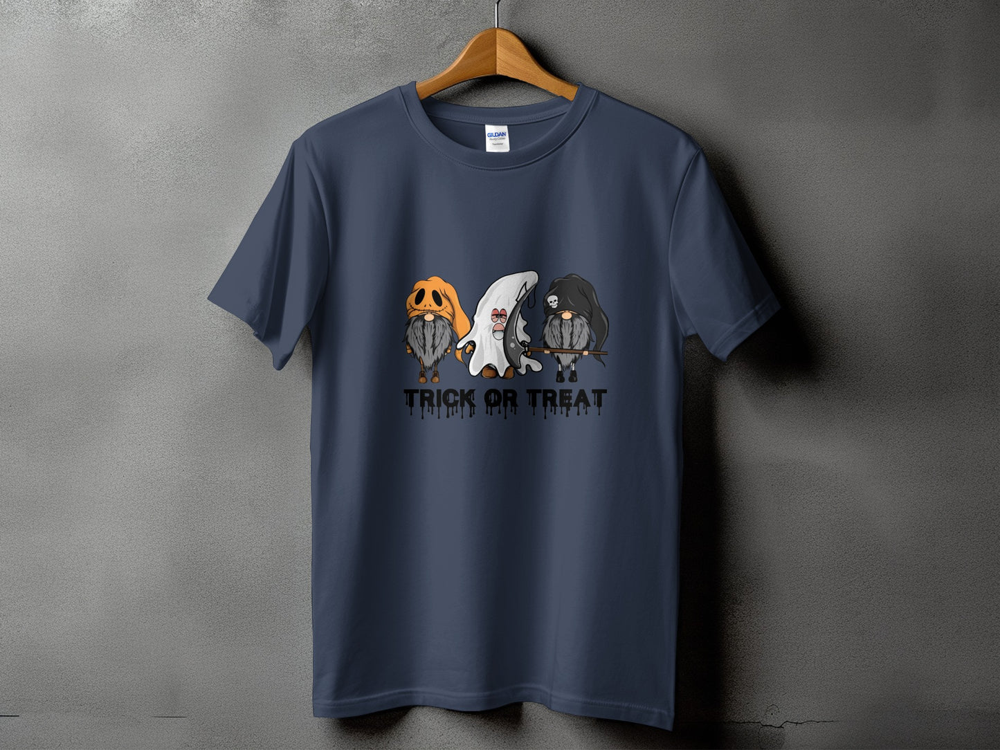 T-shirt with three gnomes in Halloween costumes and "Trick or Treat" text.