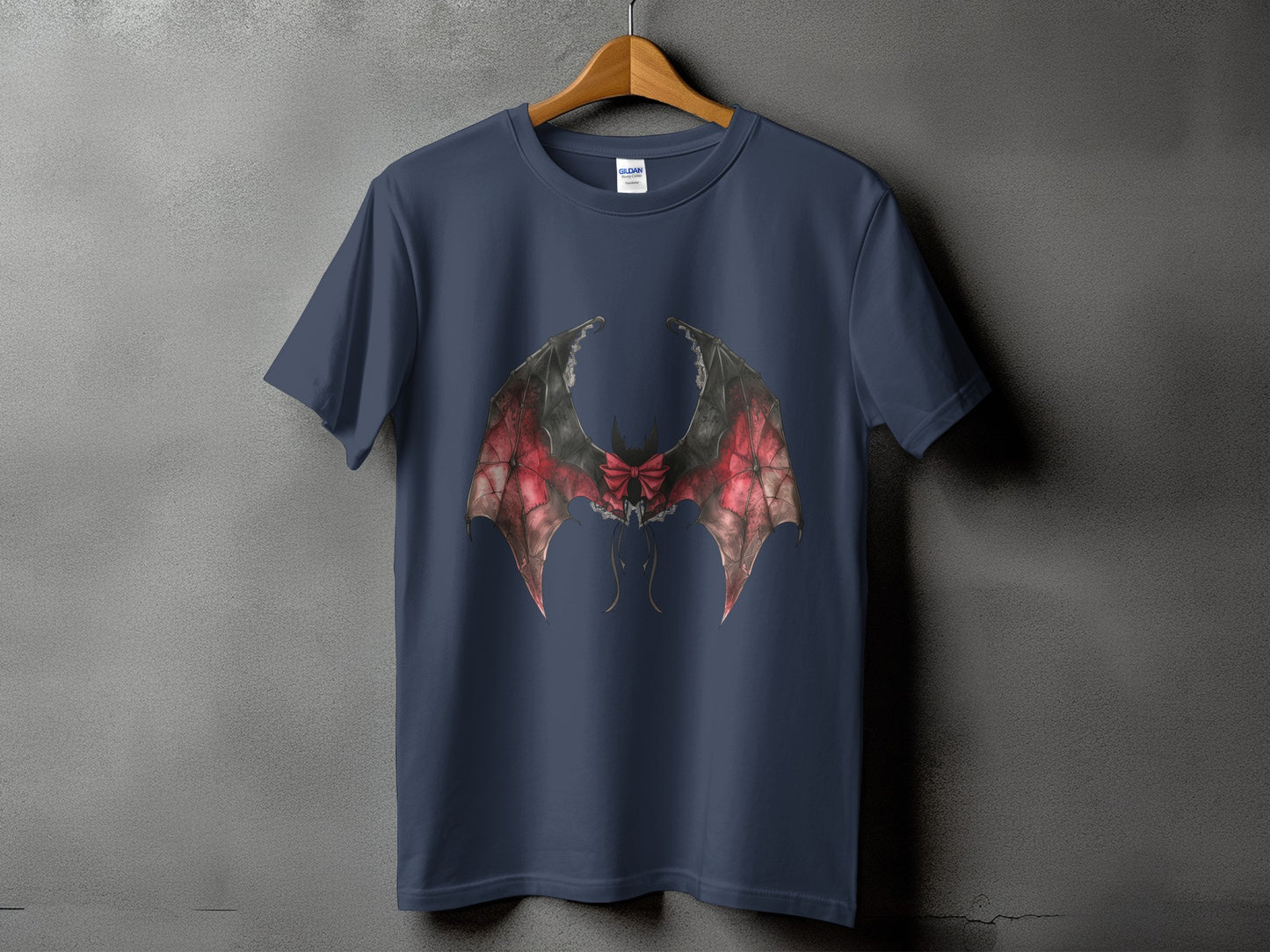 Dark blue t-shirt with red and black bat wings and bow graphic design.
