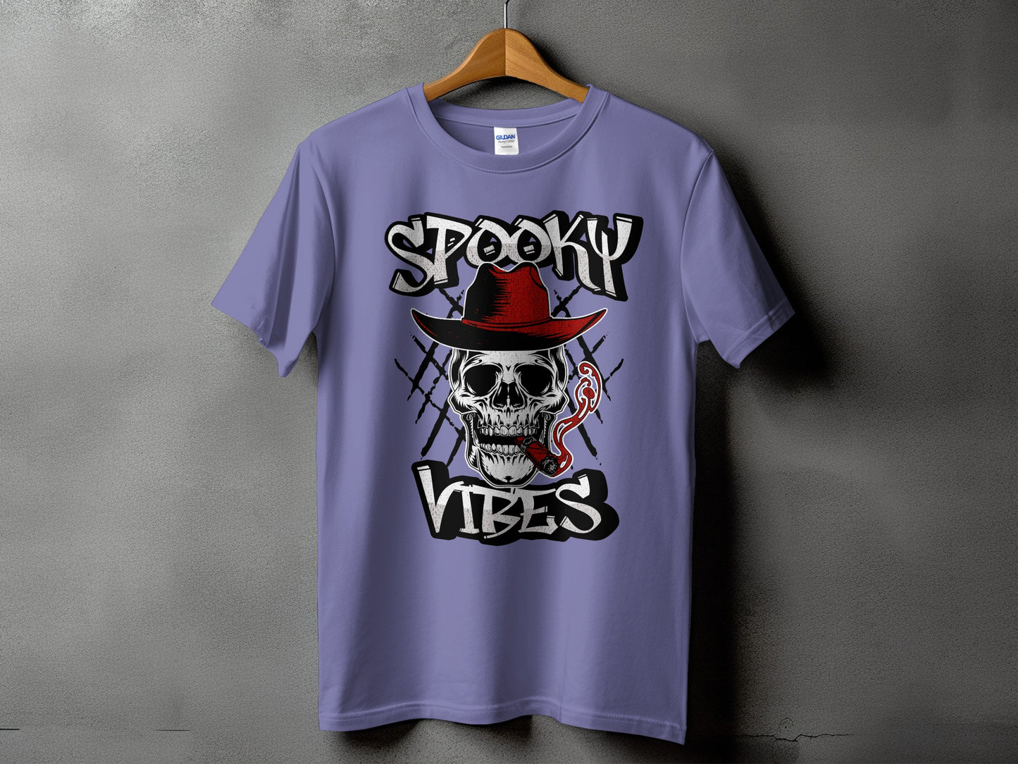 Purple t-shirt with a skull wearing a hat and smoking a cigar, text says "Spooky Vibes."