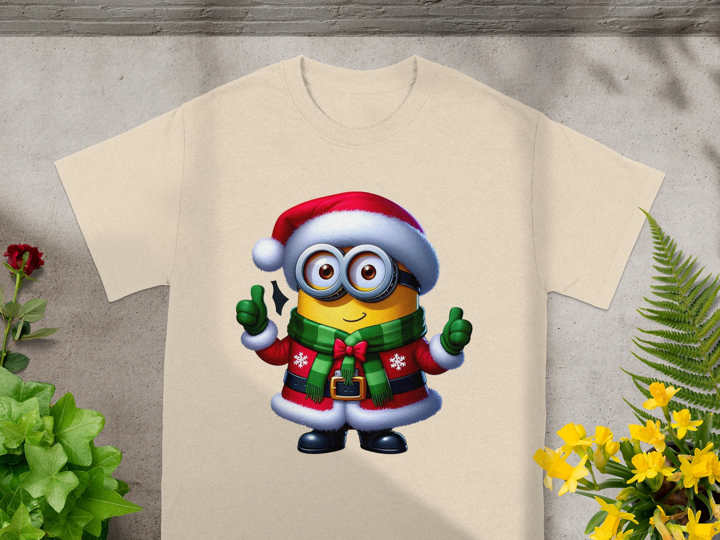 Minion in Santa hat and suit with green scarf giving thumbs up.