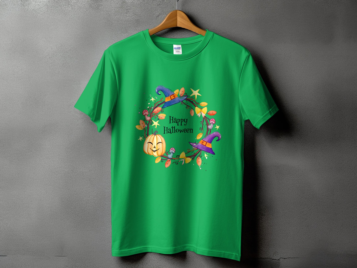 Green t-shirt with "Happy Halloween" text and pumpkin, witch hat, and leaves wreath.