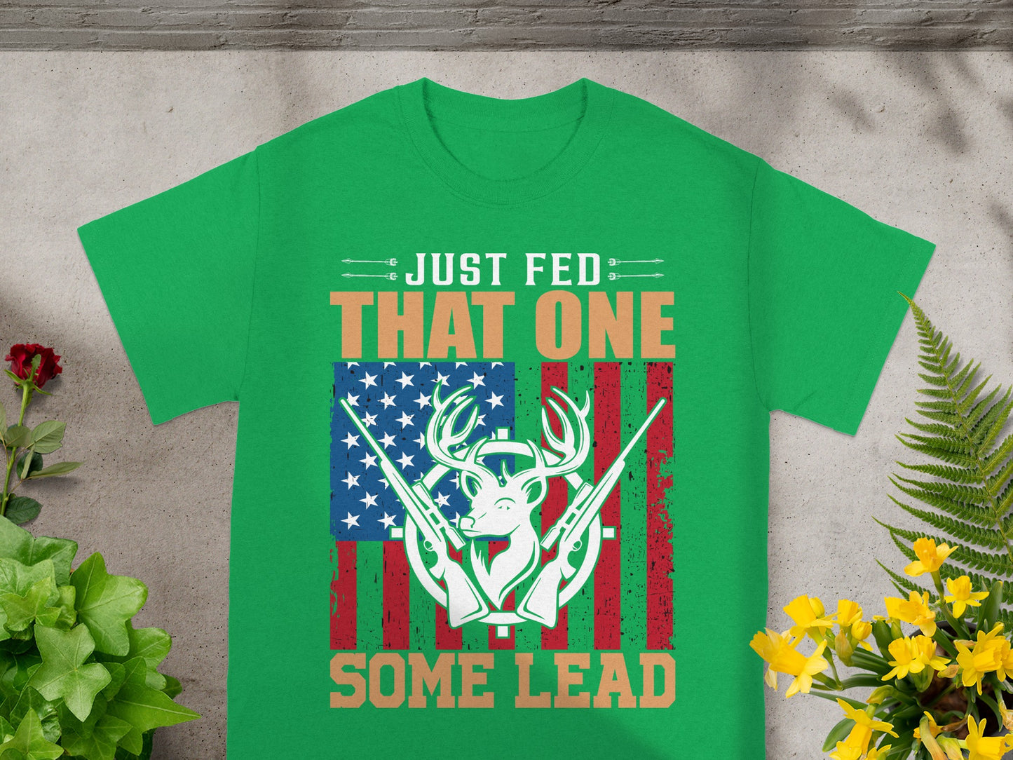 Green t-shirt with "JUST FED THAT ONE SOME LEAD" text and deer graphic.
