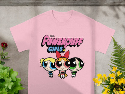 Pink t-shirt with The Powerpuff Girls characters Bubbles, Blossom, and Buttercup.
