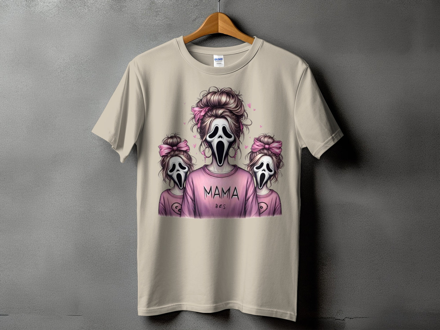T-shirt with "Mama" and "bes" text featuring ghost mask characters with pink bows.