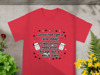 Red t-shirt with text "So excited I got a raise today! It was on my medication dosage, but a win is a win."