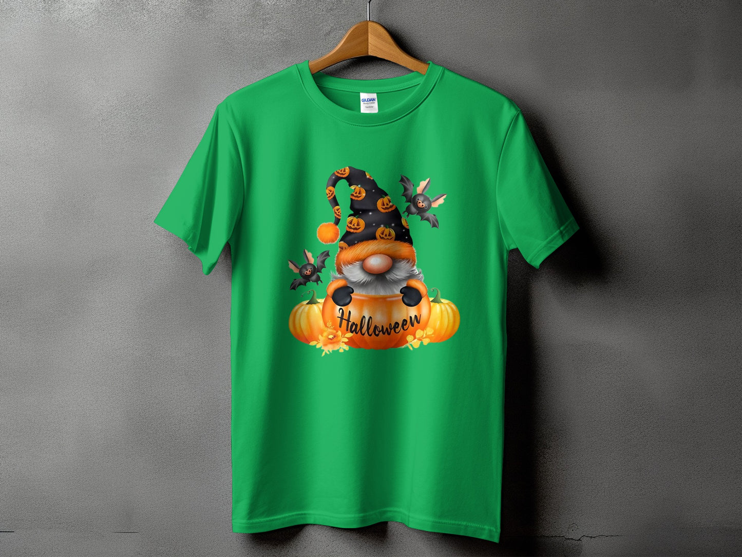 Green t-shirt with a gnome, pumpkins, and bats graphic that says "Halloween".