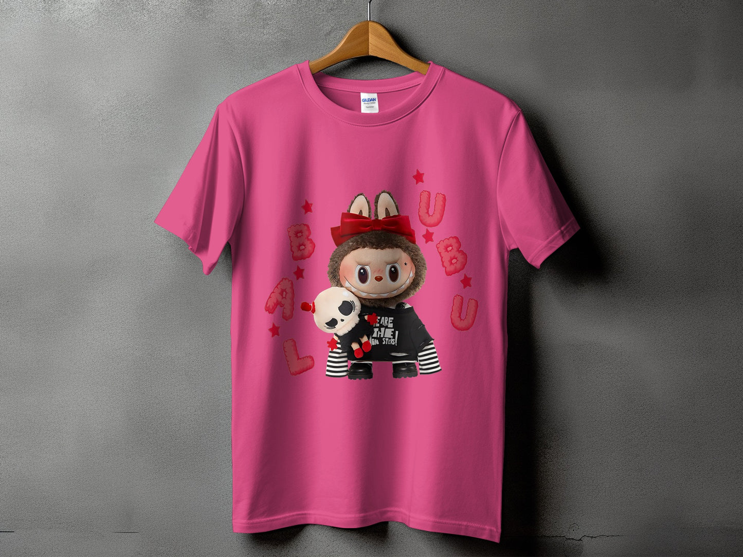 Pink t-shirt with a fuzzy creature graphic and "WE ARE THE HUMAN MONSTERS!" text.
