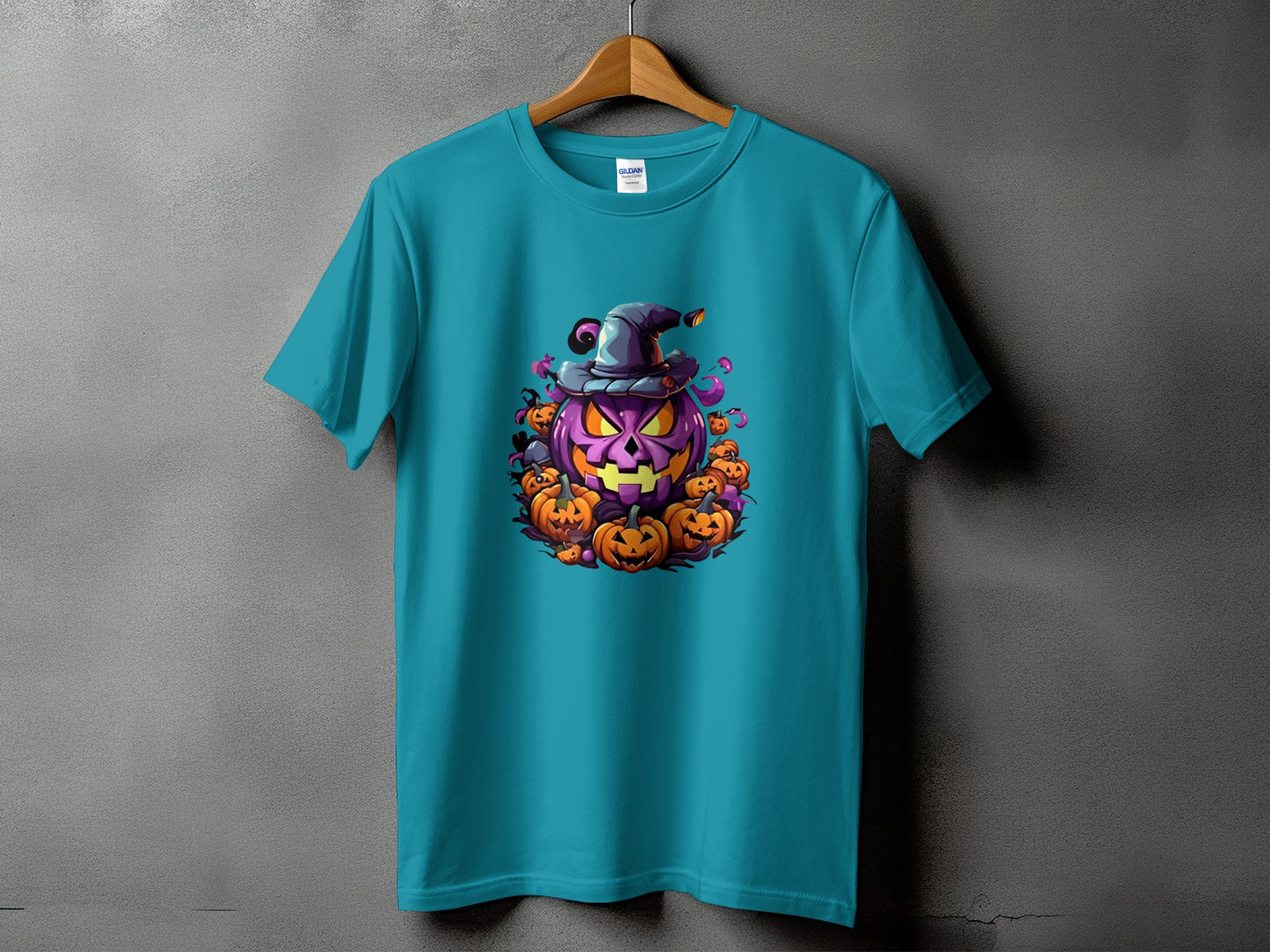 Turquoise t-shirt with a central Halloween graphic of a purple jack-o'-lantern wearing a witch hat.