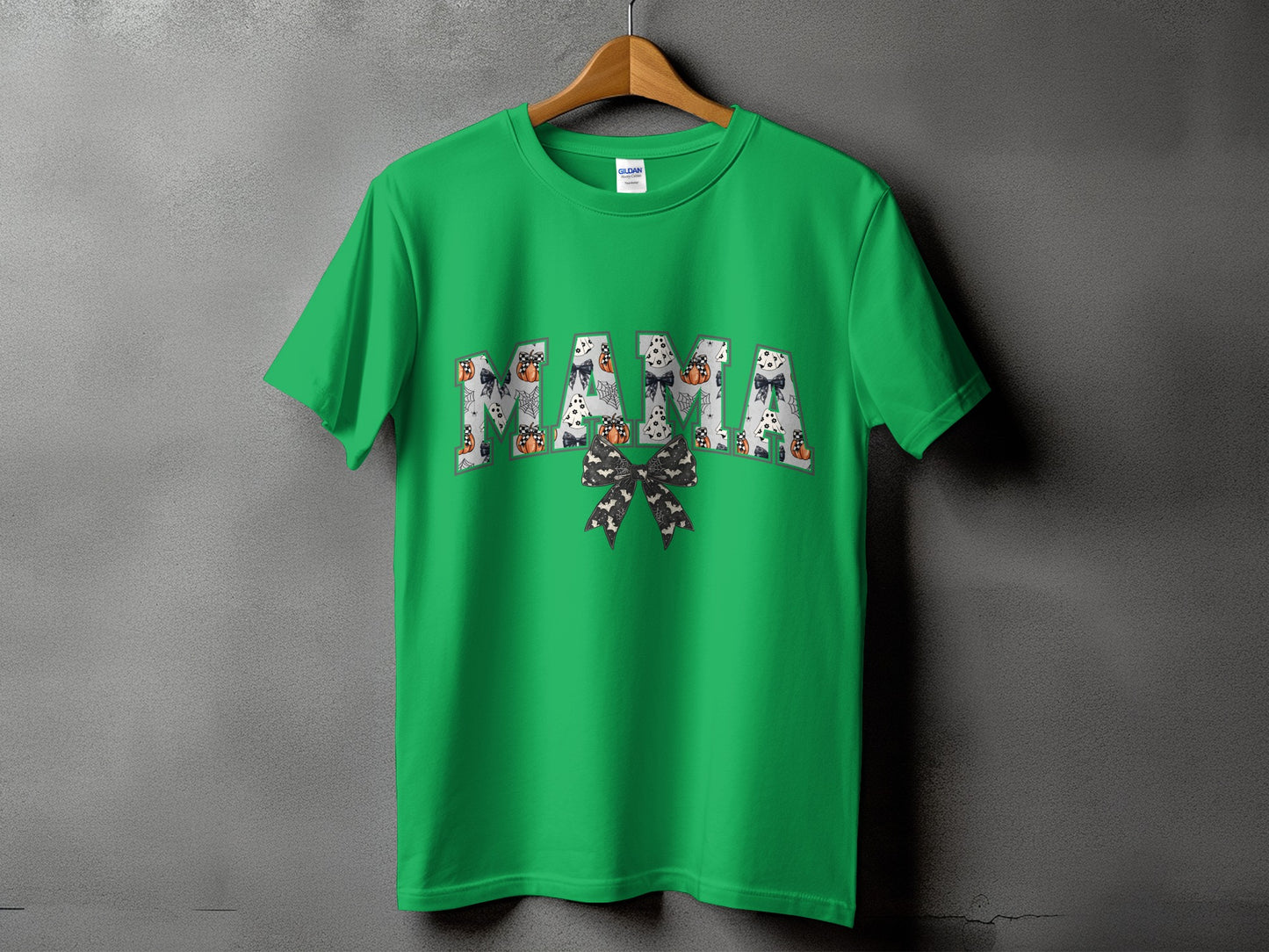 Green t-shirt with "MAMA" in Halloween-themed lettering.