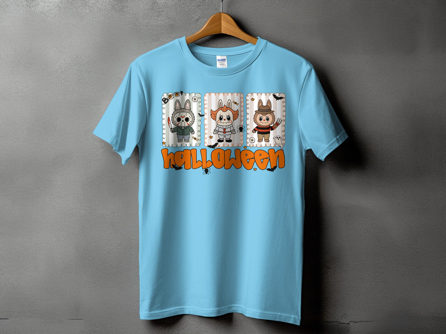Light blue t-shirt with three cartoon Halloween characters and the word "Halloween"