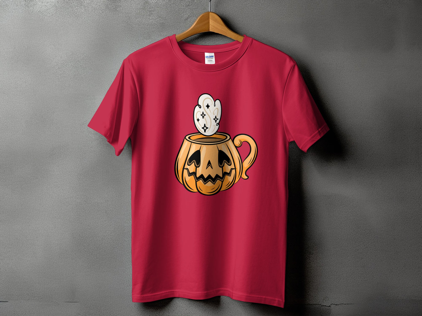 Red t-shirt with a Halloween pumpkin mug graphic featuring steam and stars.