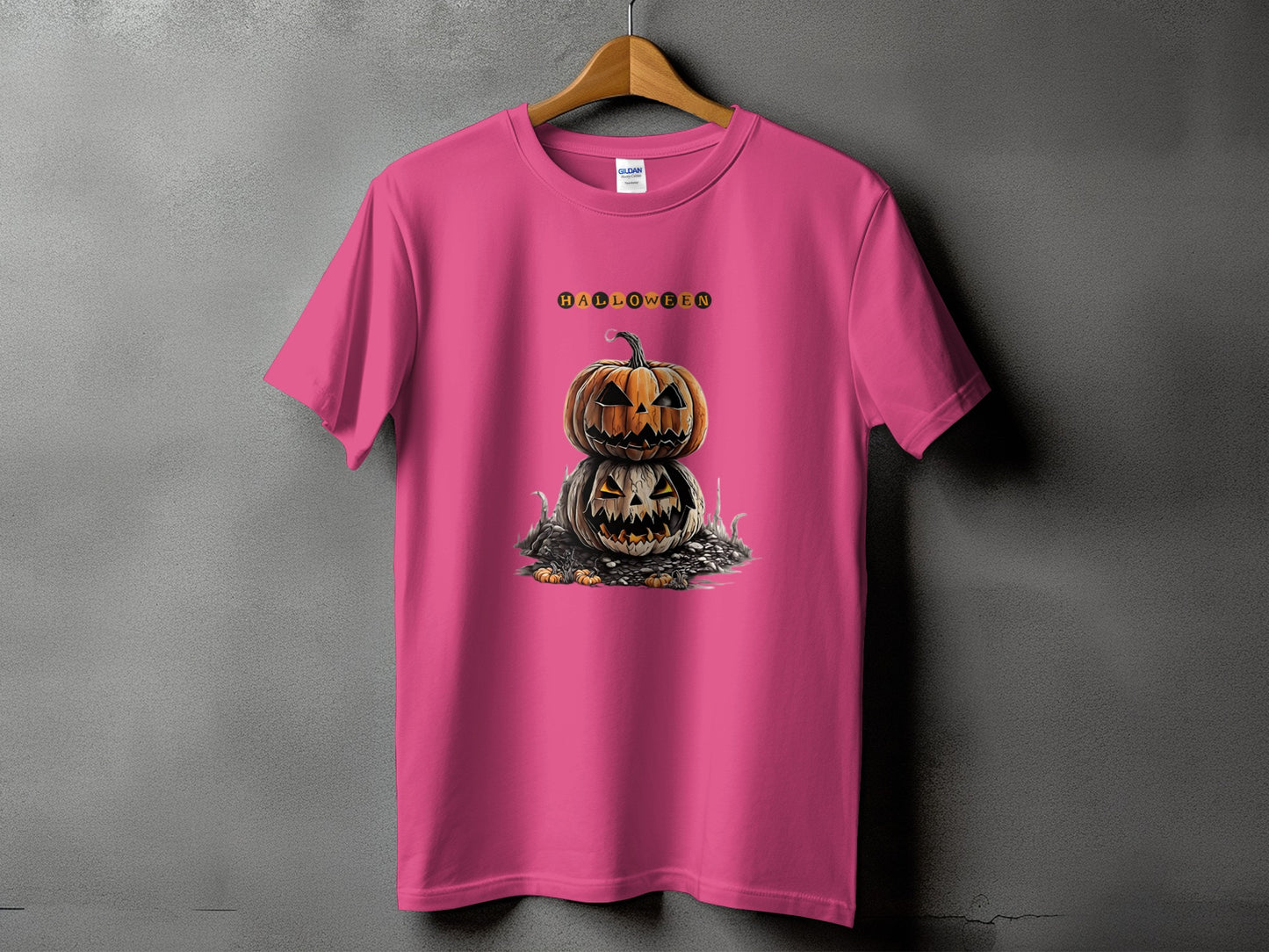 Pink t-shirt with stacked jack-o'-lanterns and "HALLOWEEN" text graphic.