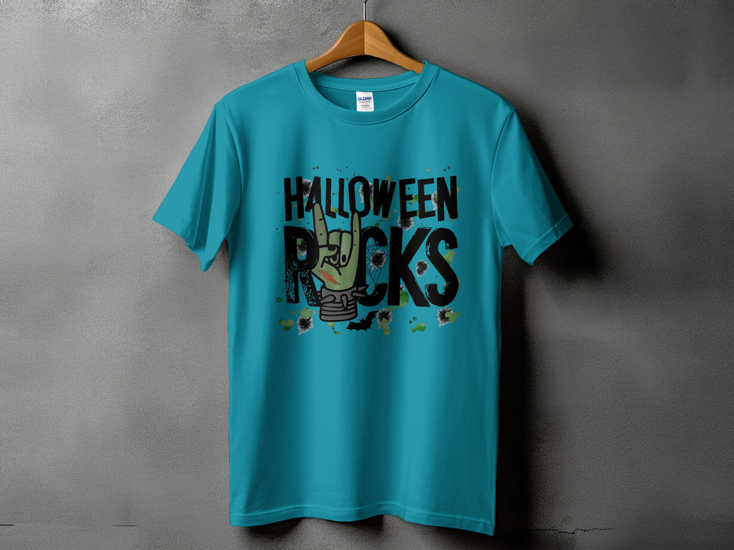 Turquoise t-shirt with "Halloween Rocks" text and zombie hand graphic.