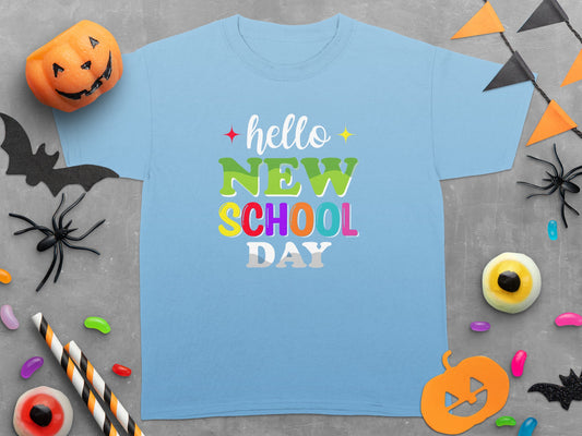 Light blue t-shirt with "hello NEW SCHOOL DAY" text and Halloween decorations.