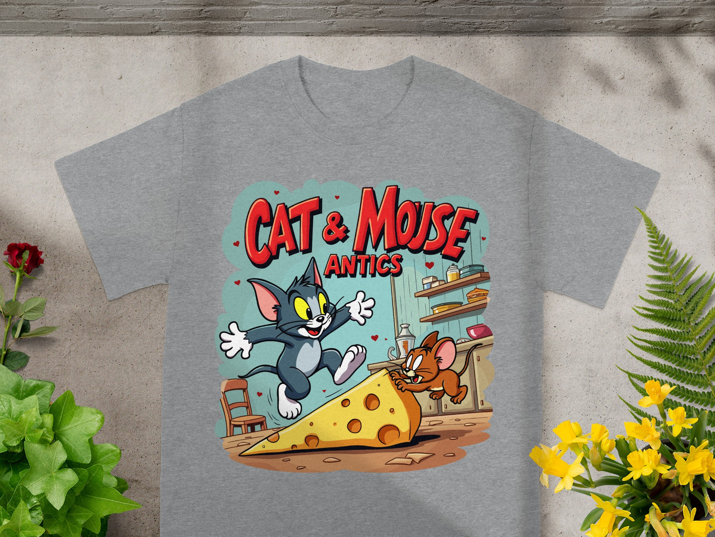 Gray t-shirt featuring Tom and Jerry chasing a large slice of cheese.