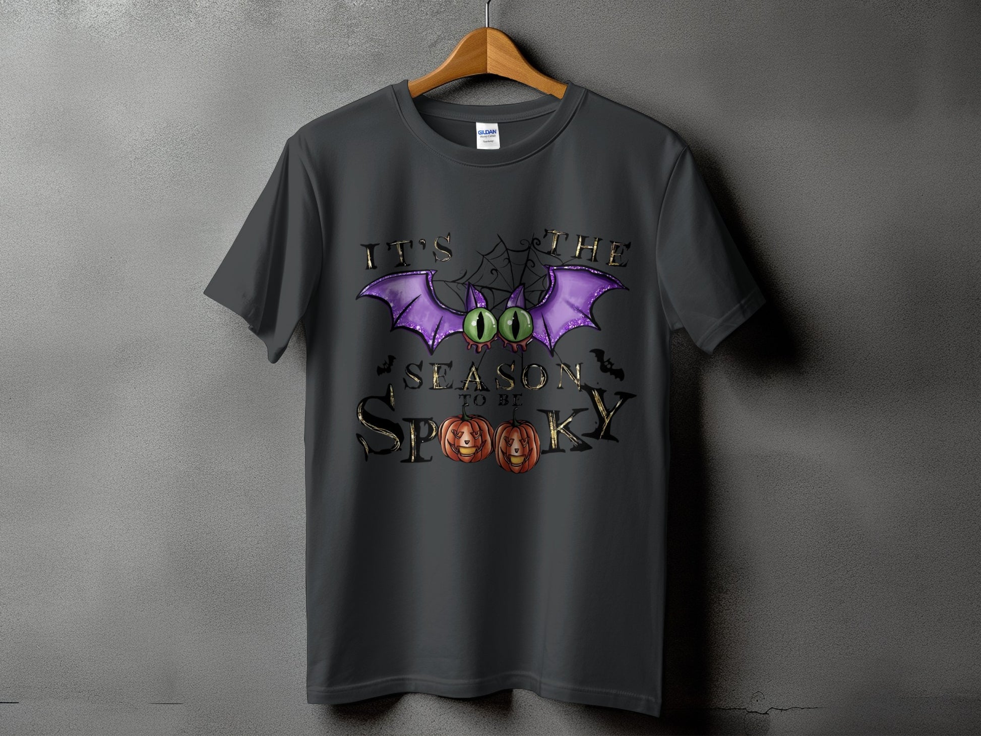 Dark gray t-shirt with "It's the season to be spooky" Halloween graphic.