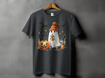 Ghost in beanie holding drink with pumpkin, bats, candles, and RIP gravestone.