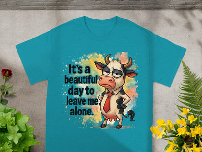 T-shirt with a cartoon cow that says "It's a beautiful day to leave me alone."