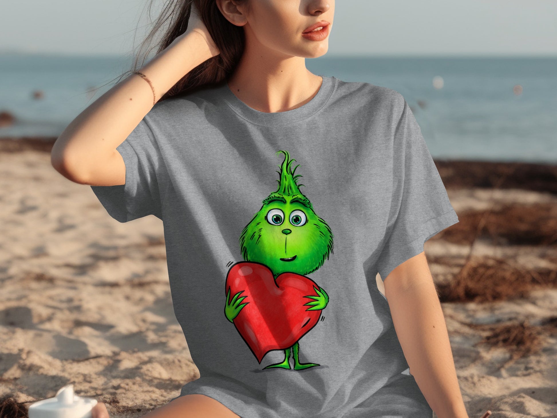 Cute Green Grinch Holding a Heart T-shirt