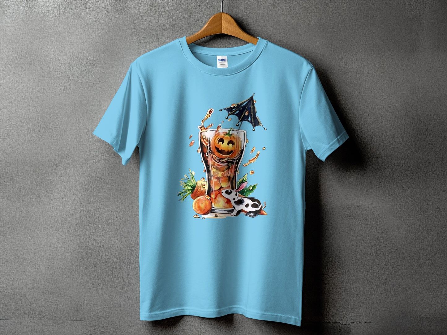 Light blue t-shirt with a glass of drink featuring a jack-o'-lantern and a black and white bunny.