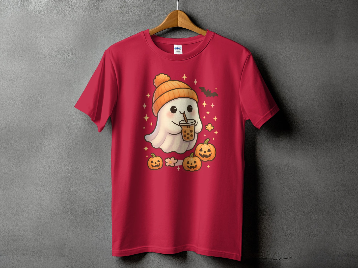 Red t-shirt with a cartoon ghost holding bubble tea, pumpkins, and a bat.
