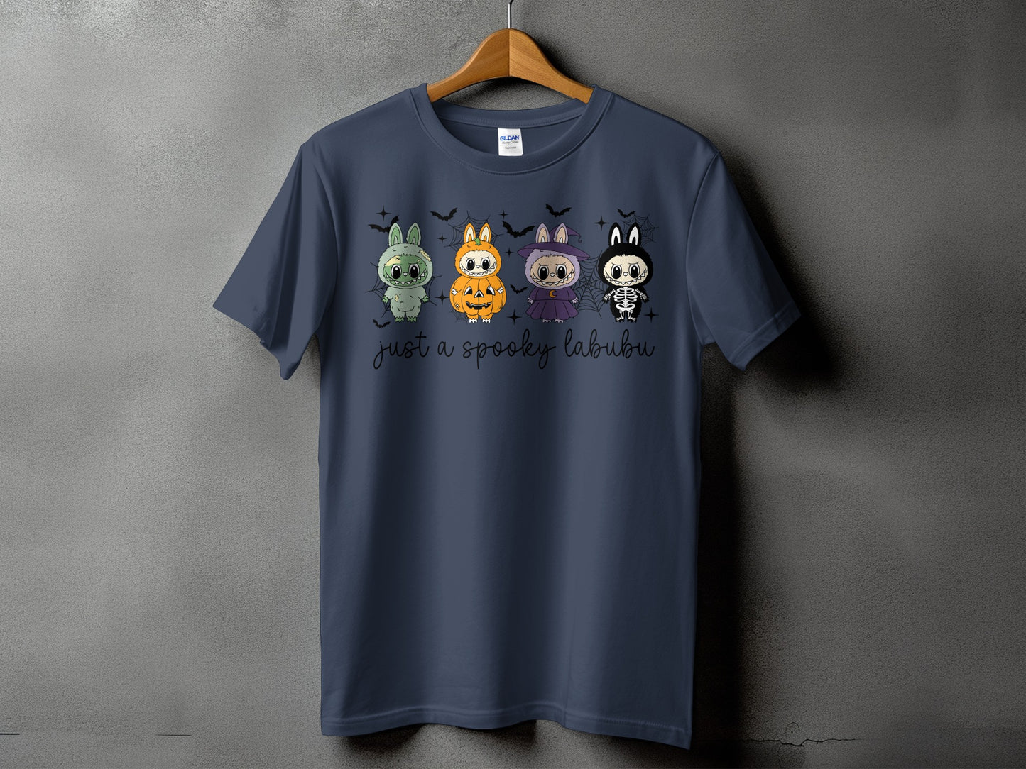 Dark blue t-shirt with four cartoon characters and the text "just a spooky labubu".