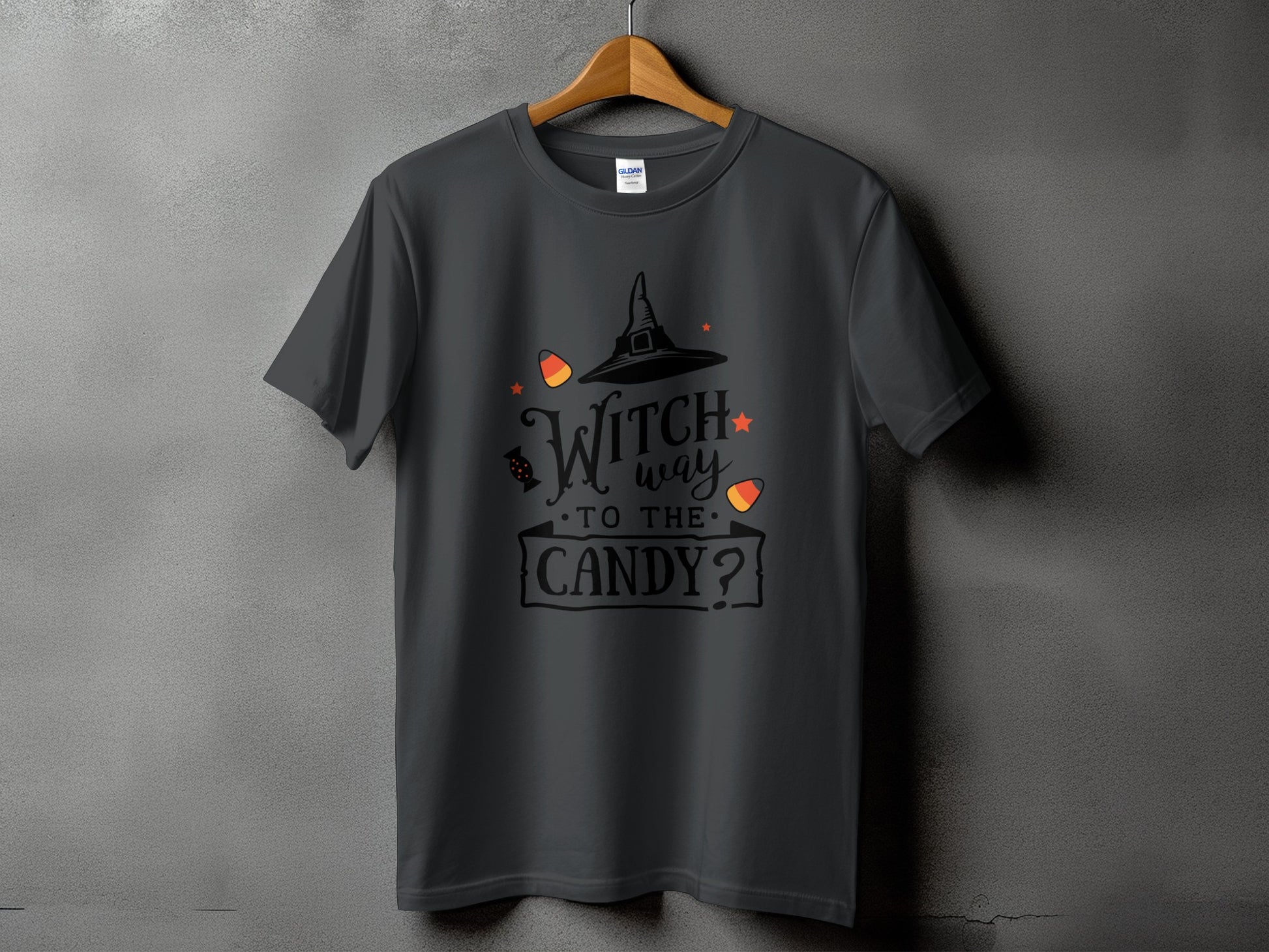 Dark grey t-shirt with "Witch way to the candy?" Halloween graphic.
