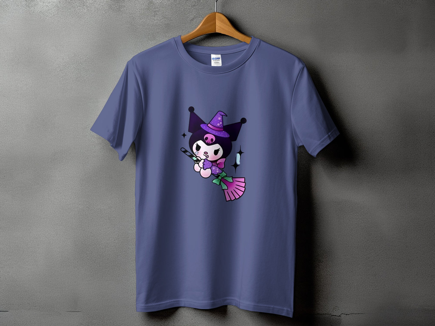 Kuromi character wearing a witch hat riding a broomstick on a purple t-shirt.