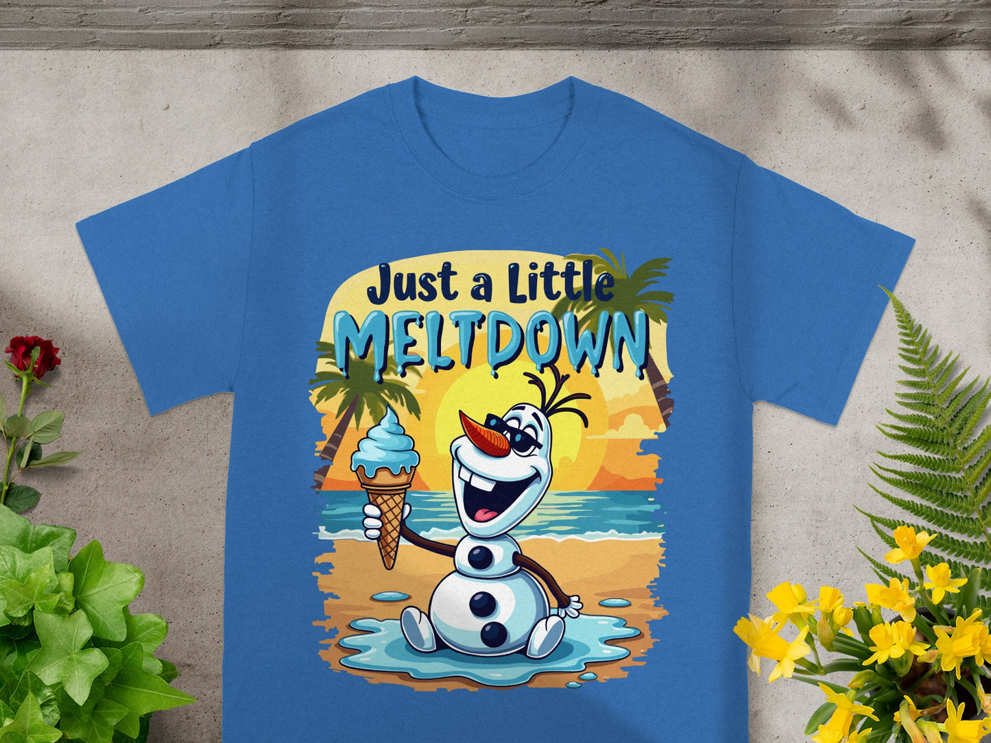 Blue t-shirt with Olaf character holding an ice cream cone on a beach.