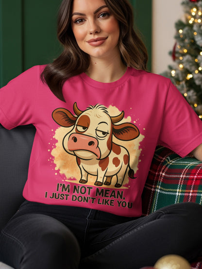 Pink t-shirt with a cartoon cow and text "I'M NOT MEAN, I JUST DON'T LIKE YOU".