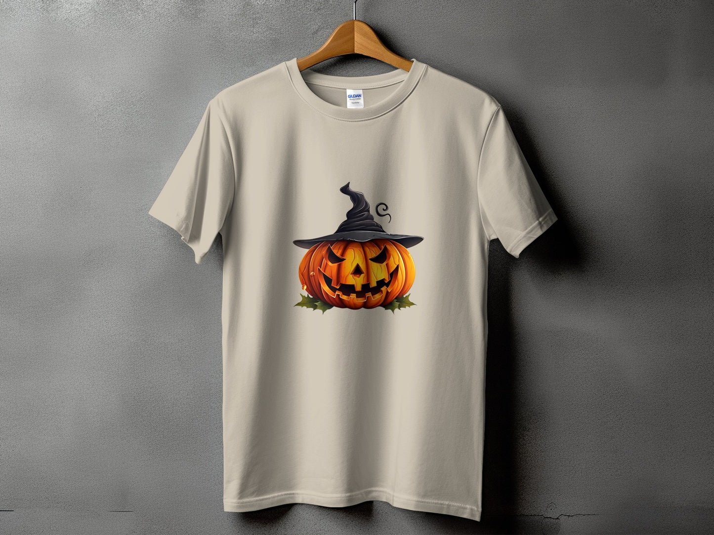Beige t-shirt with jack-o'-lantern wearing a witch hat graphic.