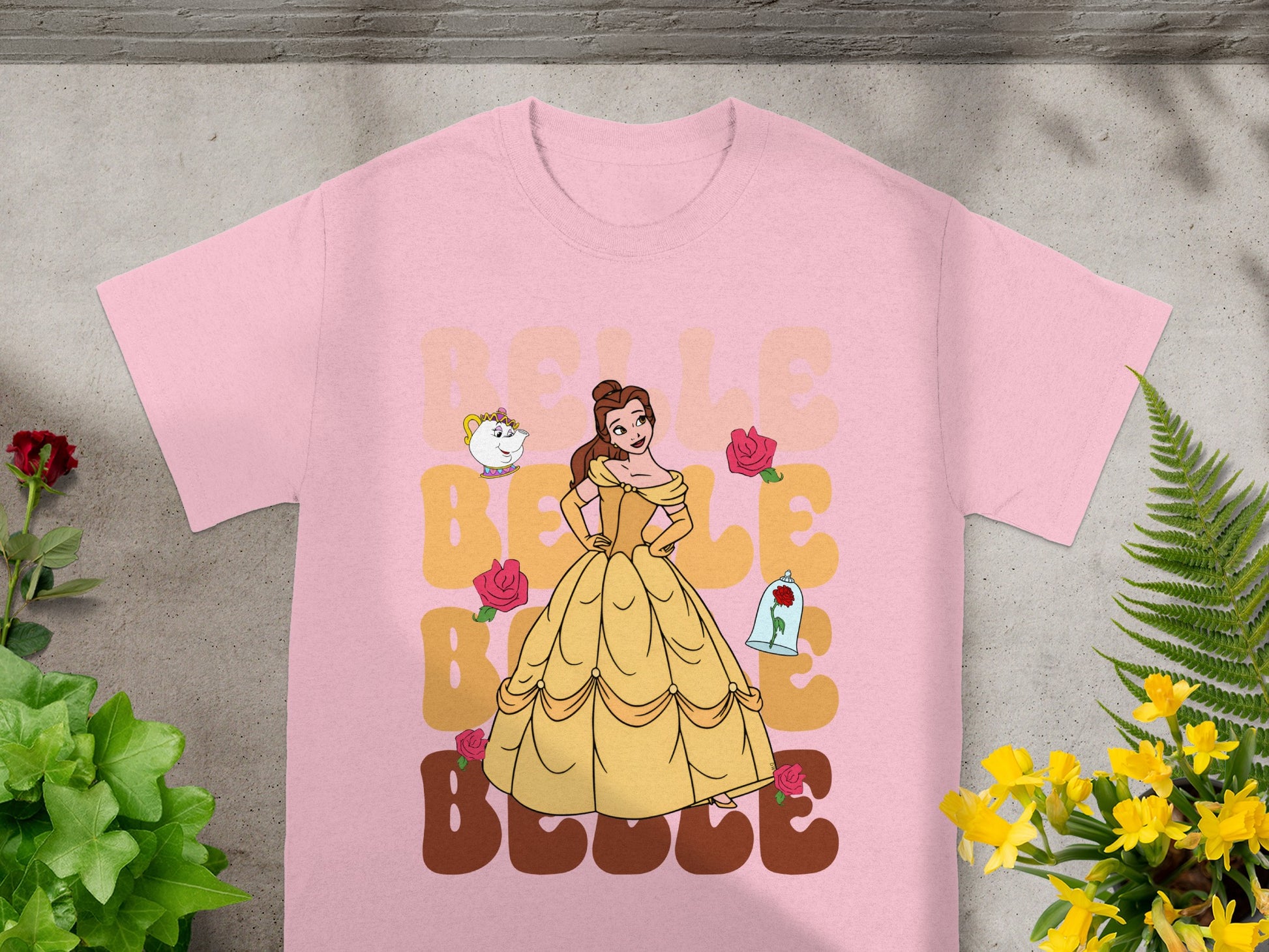 Belle from Beauty and the Beast on pink t-shirt with roses and teapot graphic.