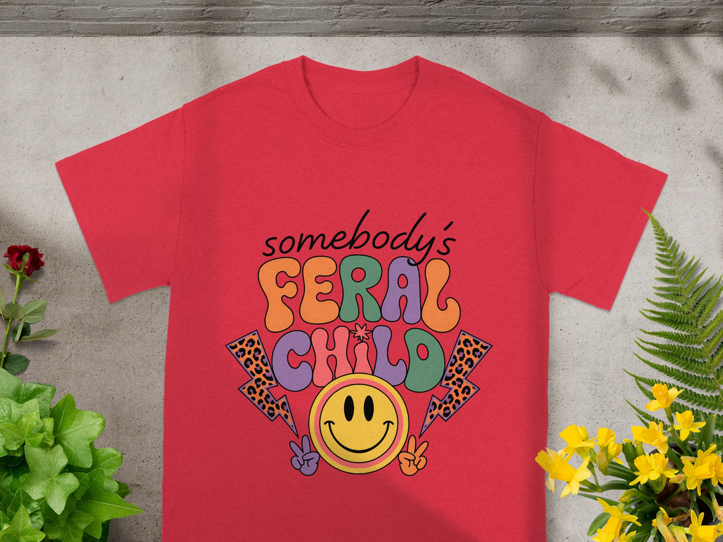 Red t-shirt with "somebody's FERGL CHILD" text and smiley face graphic.