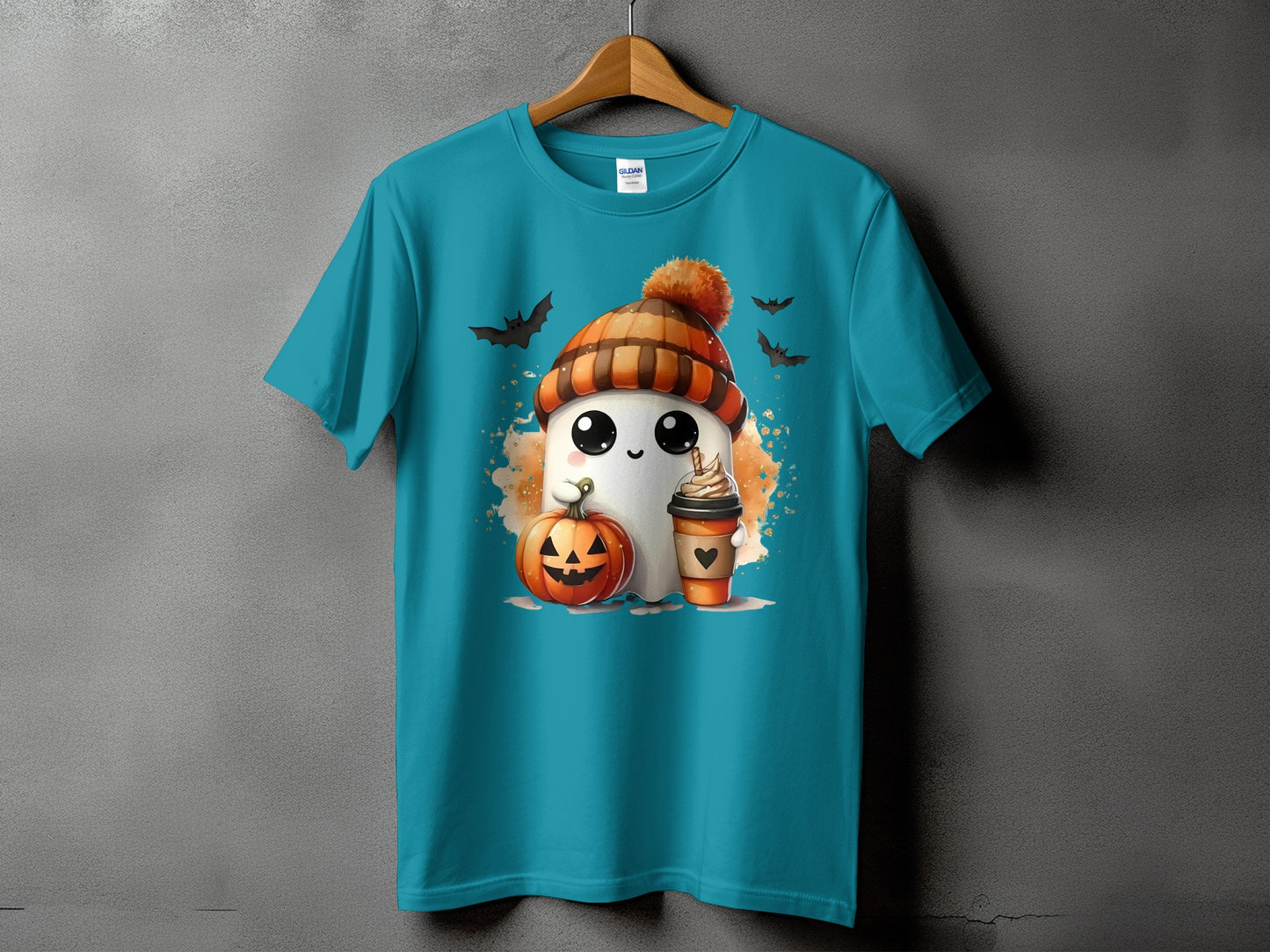 Teal t-shirt with ghost, pumpkin, coffee, and bats Halloween graphic.
